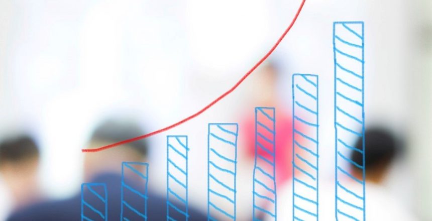 growth bar chart with blurred business people background